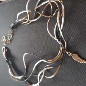 Leather Cord and curved metal Wrap Around Bracelet.
